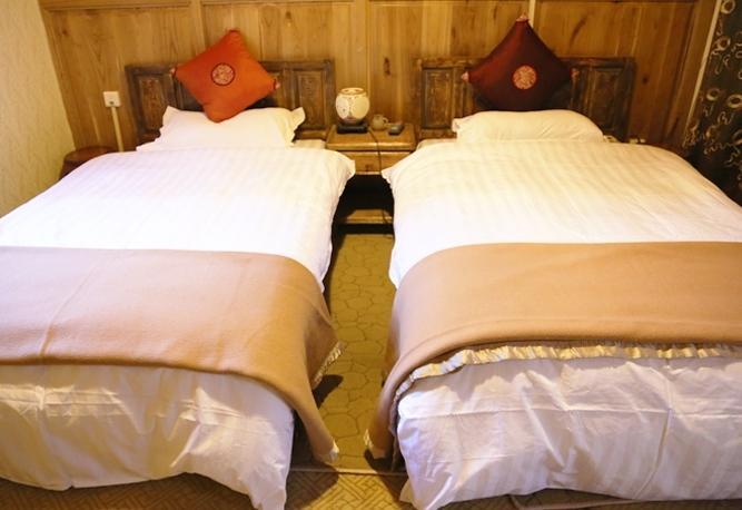 Aparthotel Li Dao Yuan à Lijiang  Chambre photo
