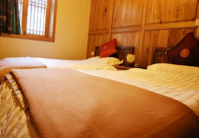 Aparthotel Li Dao Yuan à Lijiang  Chambre photo
